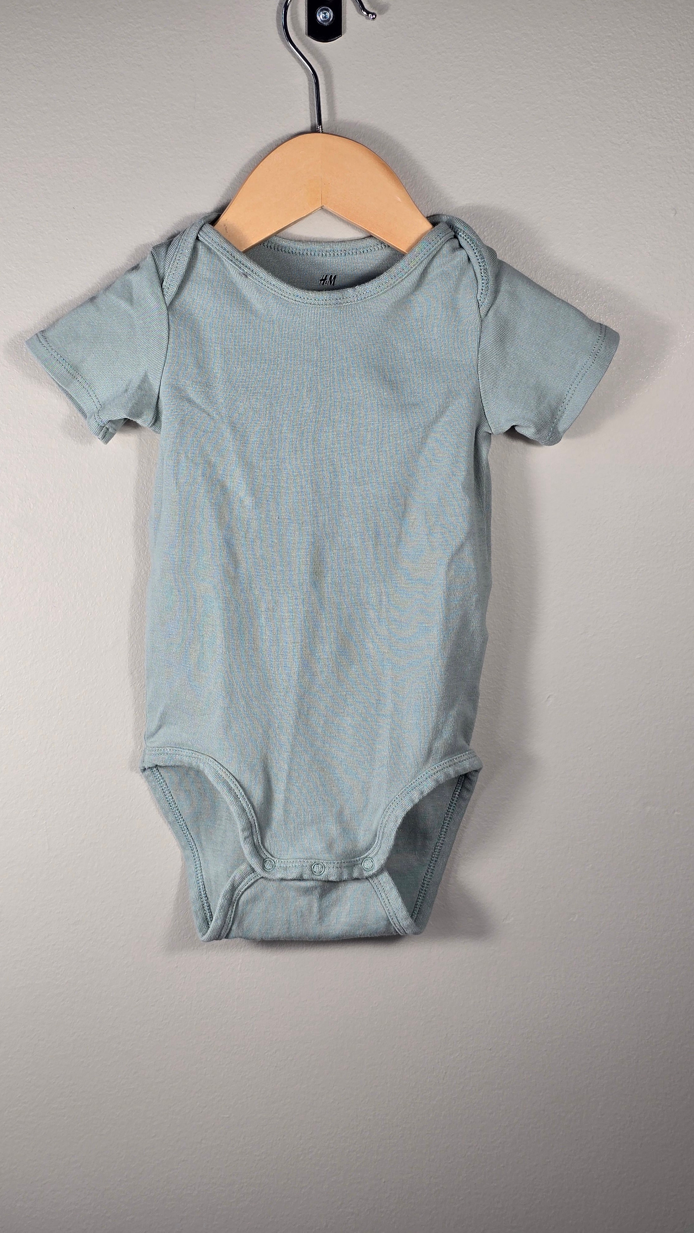 4-pack H&M bodysuits 12-18 months